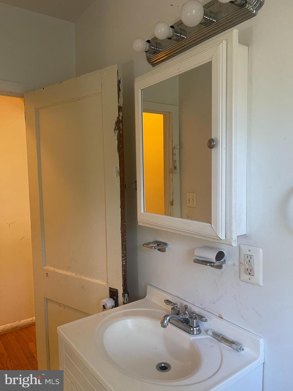 7968 Telegraph Road Severn, MD 21144 - Photo 9 of 26 a bathroom with a sink a window and a mirror