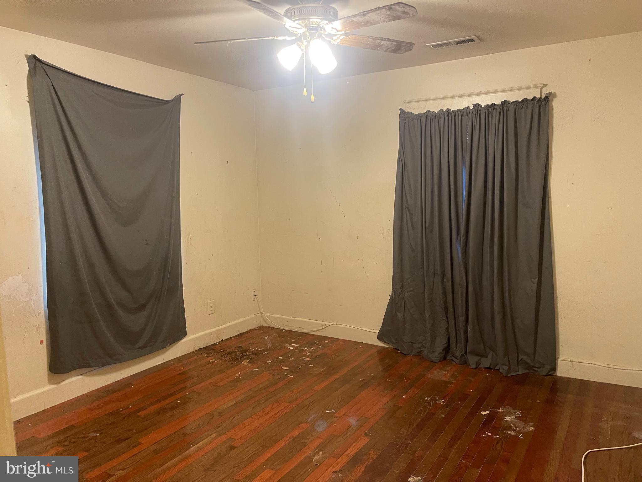 7968 Telegraph Road Severn, MD 21144 - Photo 10 of 26 en empty room with wooden floor and closet