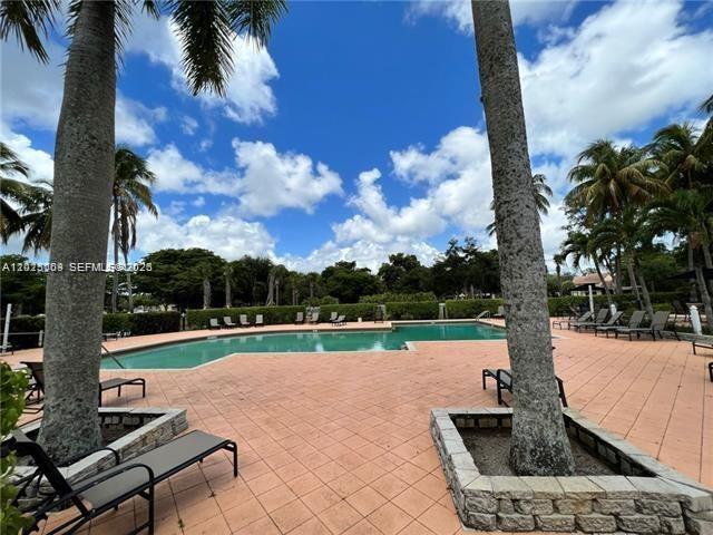 951 Lyons Road, Unit 6206 Coconut Creek, FL 33063 - Photo 10 of 27 a view of a park with swings and slides