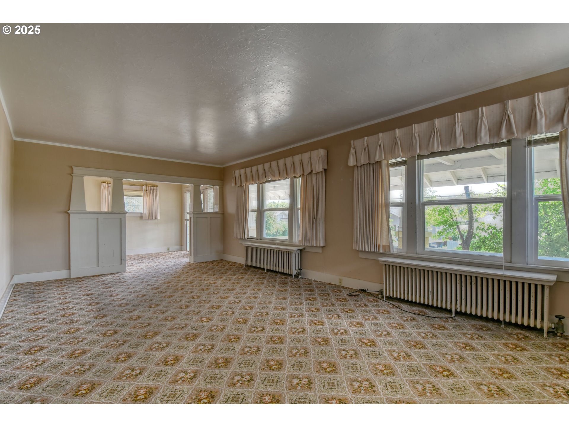 815 Northwest Bailey Avenue Pendleton, OR 97801 - Photo 5 of 44 a view of an empty room with a window