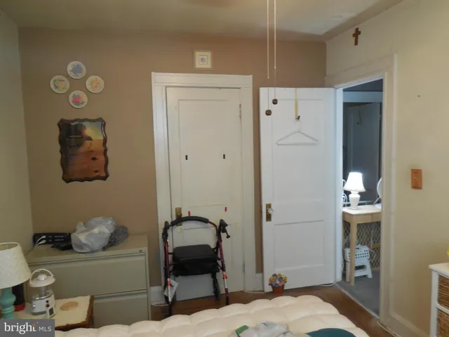 a bedroom with a bed and a table in it