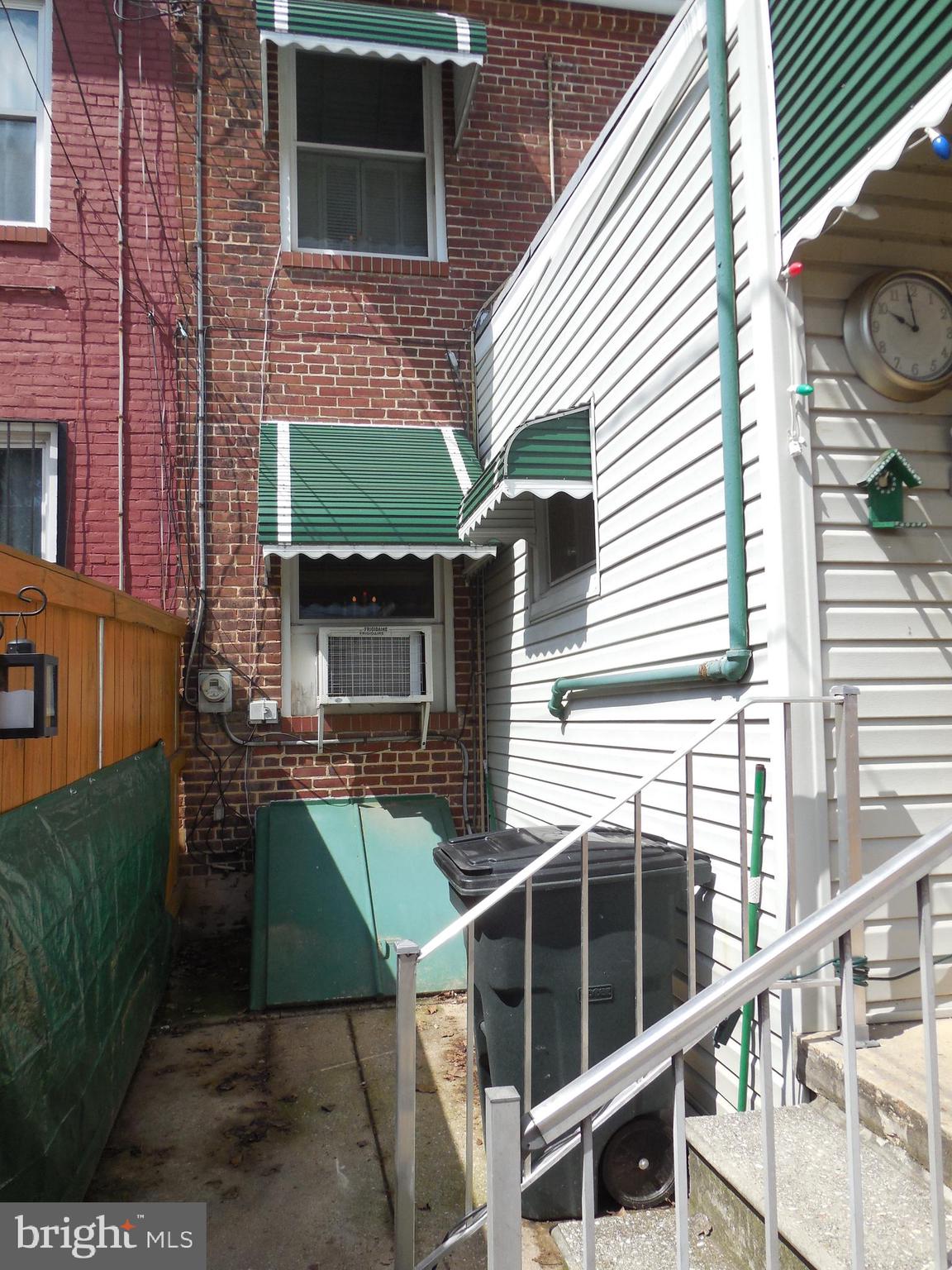 3314 Kenyon Avenue Baltimore, MD 21213 - Photo 21 of 21 a view of a house with a door and a window