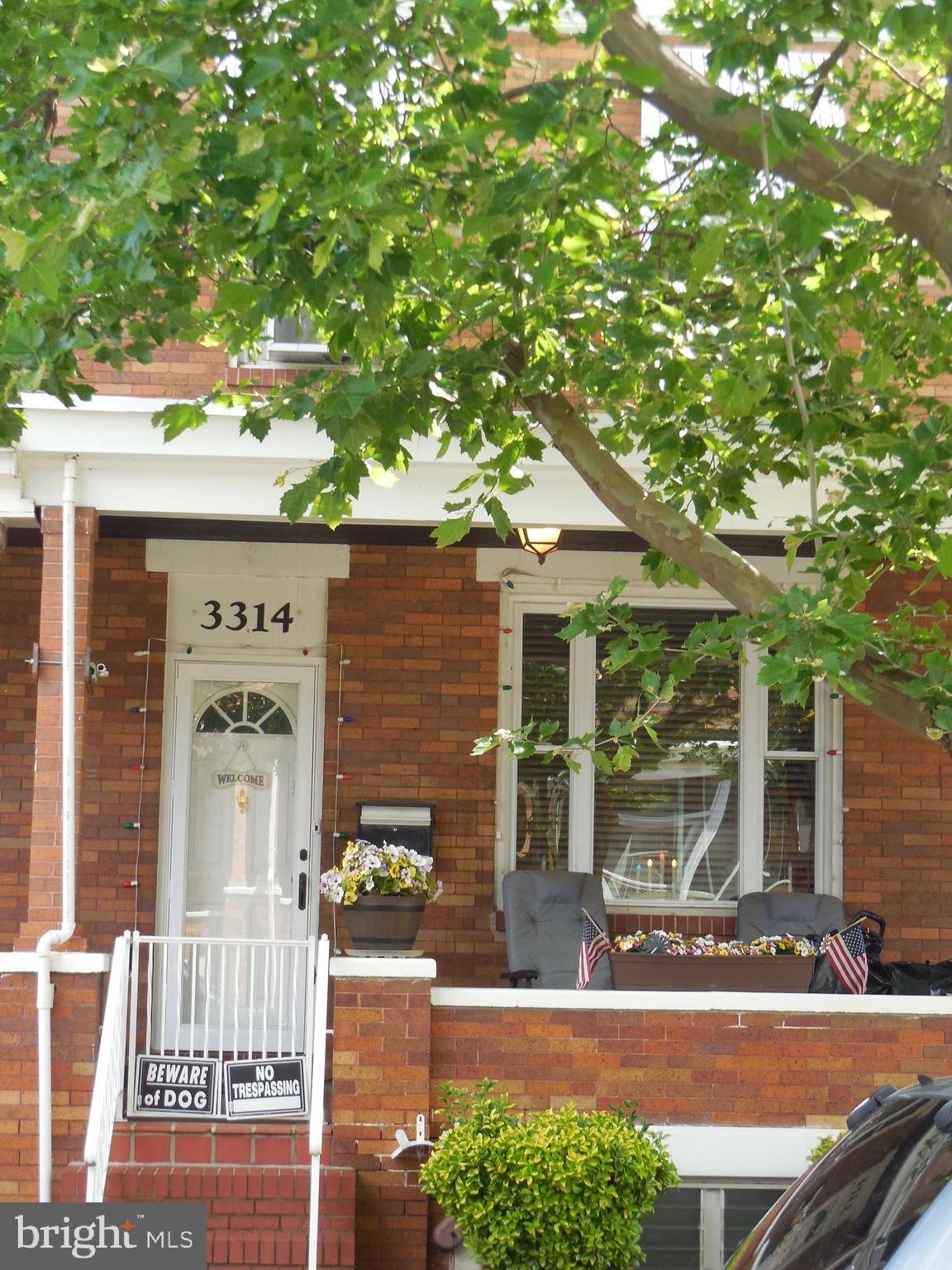 3314 Kenyon Avenue Baltimore, MD 21213 - Photo 3 of 21 front view of a house with a tree