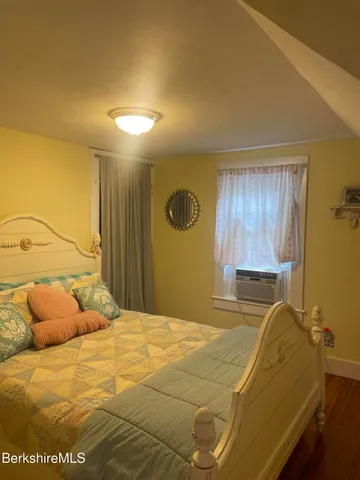 a bedroom with a bed and a cabinets