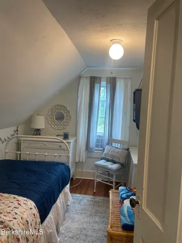 a view of hall way with furniture