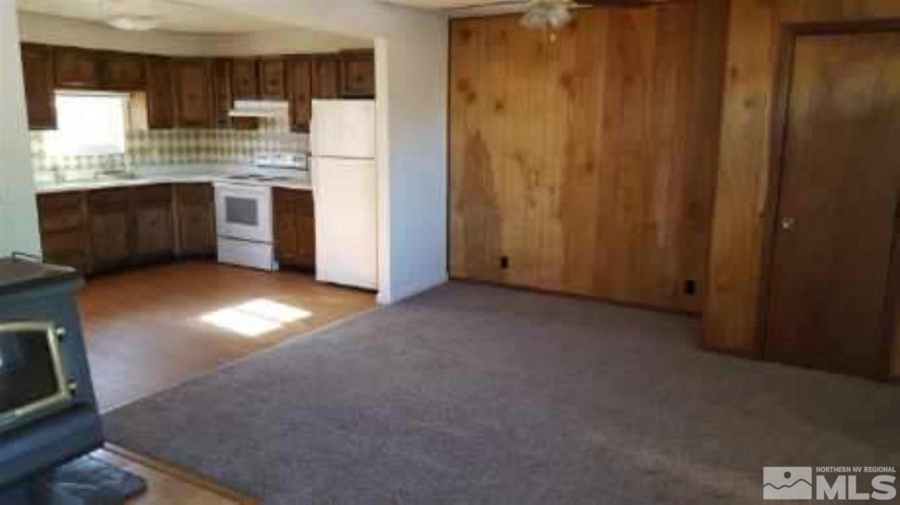 237-245 F Street Hawthorne, NV 89415 - Photo 12 of 21 a view of kitchen with stainless steel appliances granite countertop cabinets and window
