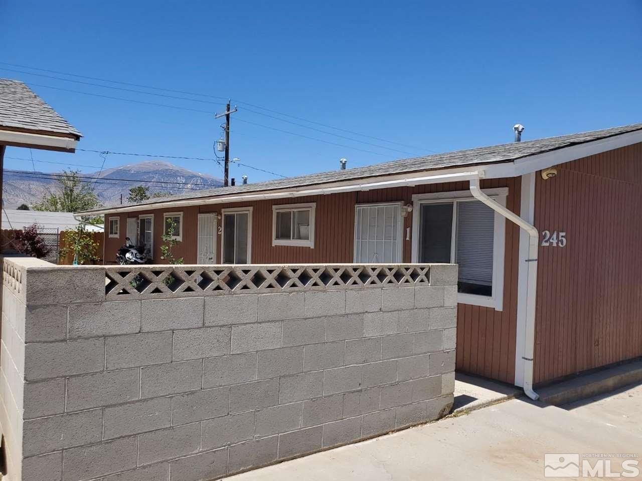 237-245 F Street Hawthorne, NV 89415 - Photo 2 of 21 a front view of a house with a yard