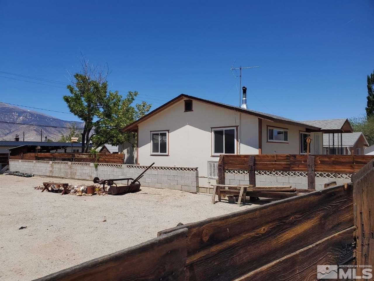 237-245 F Street Hawthorne, NV 89415 - Photo 3 of 21 a view of a house with a yard