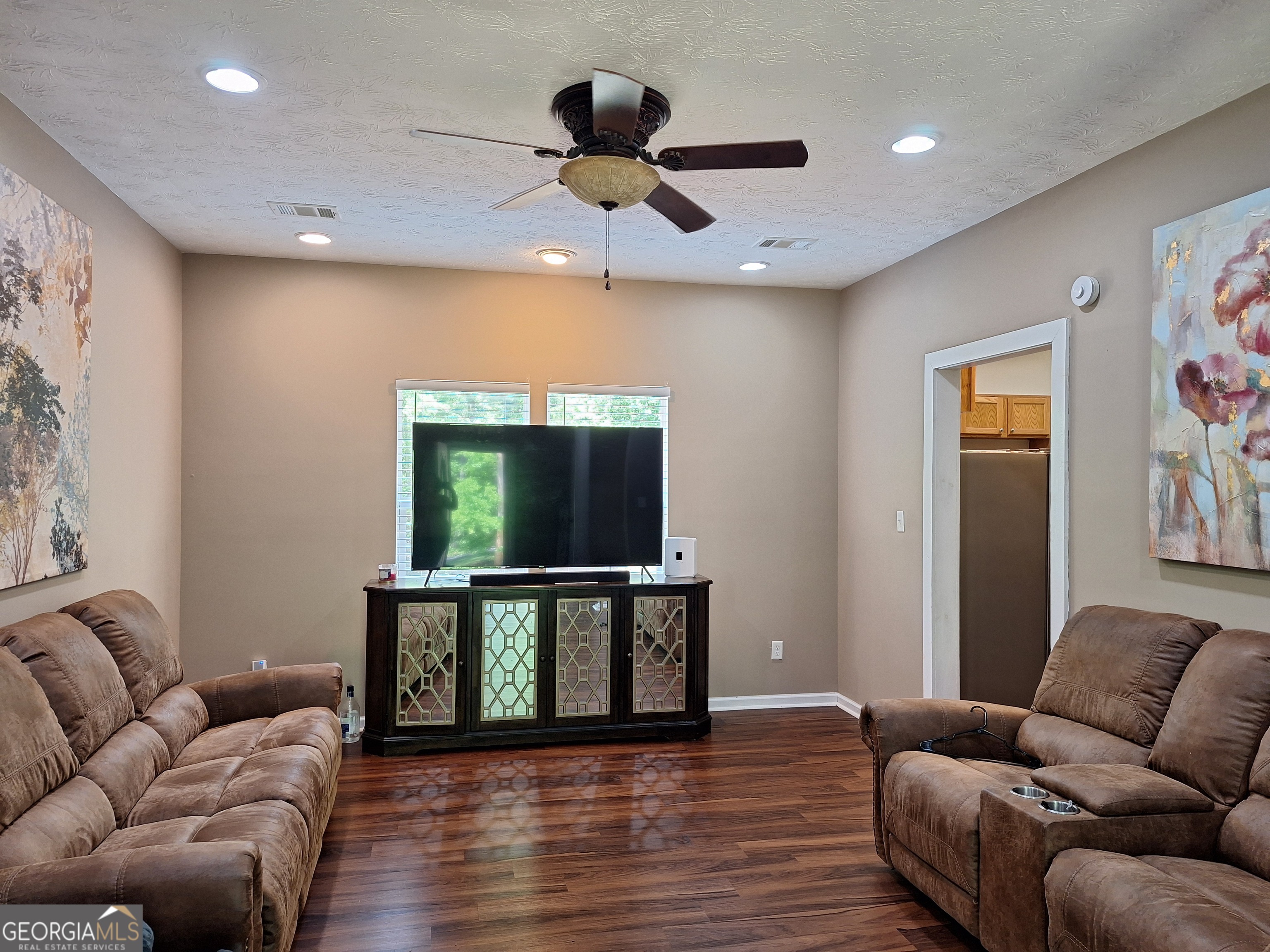 806 Springfield Drive Lafayette, AL 36862 - Photo 11 of 19 a living room with furniture and a flat screen tv