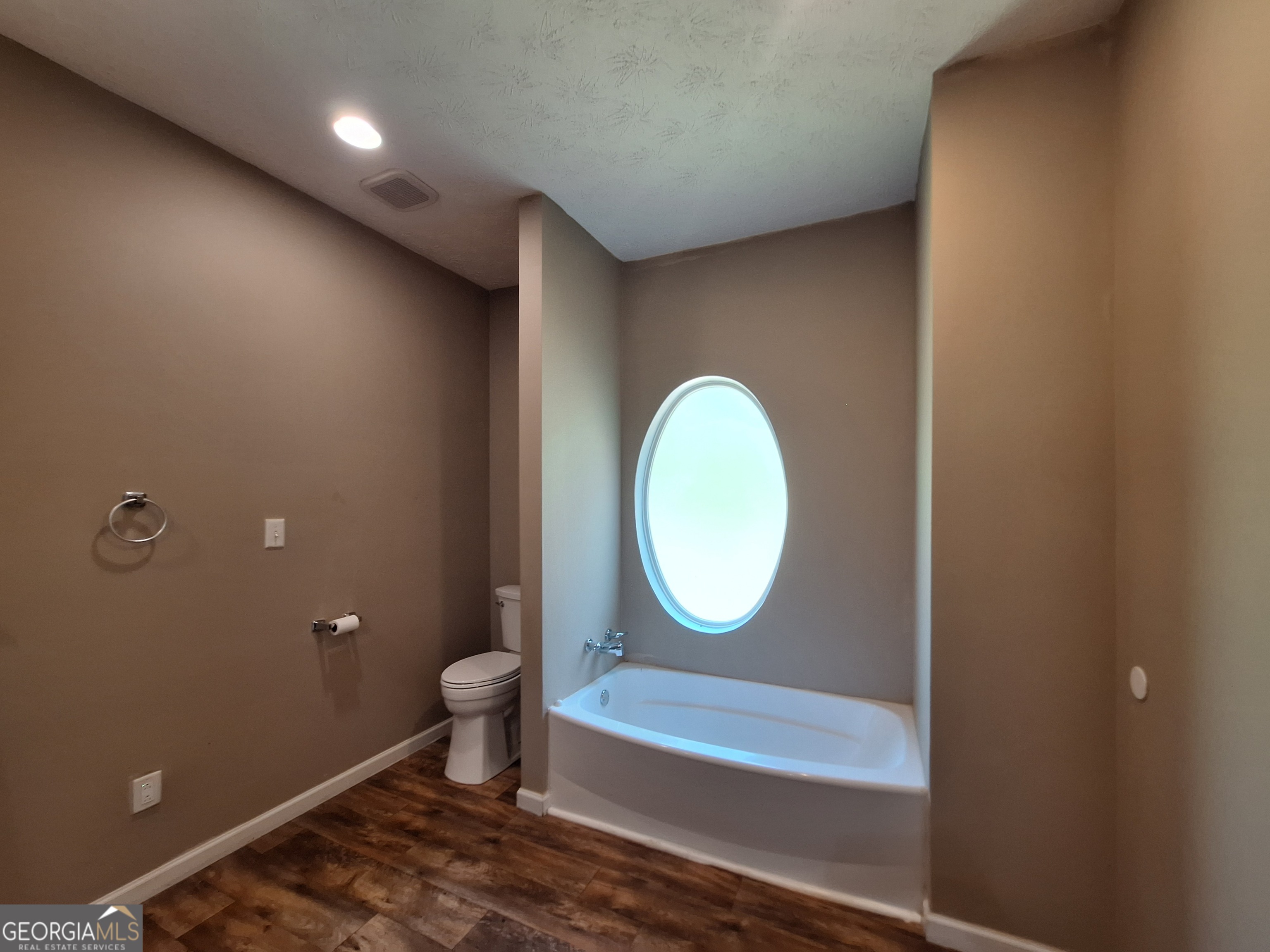 806 Springfield Drive Lafayette, AL 36862 - Photo 15 of 19 a bathroom with a toilet a sink and a mirror