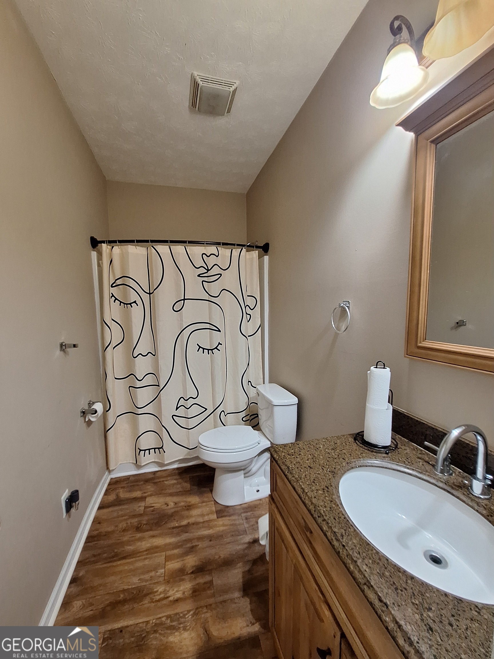 806 Springfield Drive Lafayette, AL 36862 - Photo 19 of 19 a bathroom with a granite countertop sink and a mirror