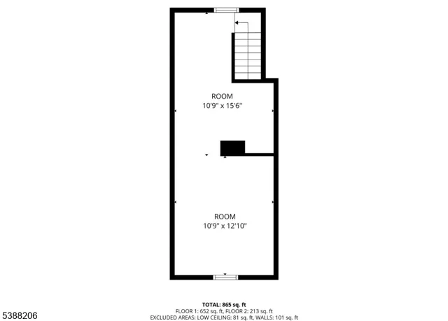 a picture of a bench in front of a wall