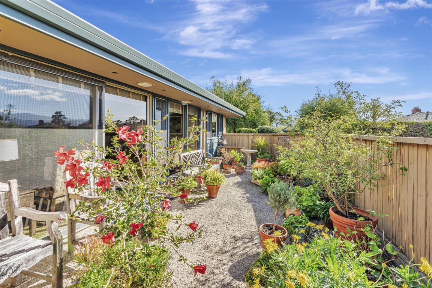 74 Del Mesa Carmel Carmel, CA 93923 - Photo 15 of 20 a front view of house and yard with beautiful flowers