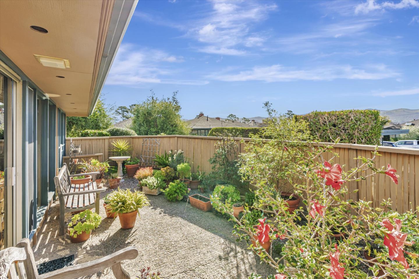 74 Del Mesa Carmel Carmel, CA 93923 - Photo 16 of 20 a view of a potted flower in a yard next to a yard
