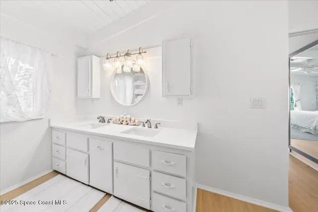 a large white bed in a white room