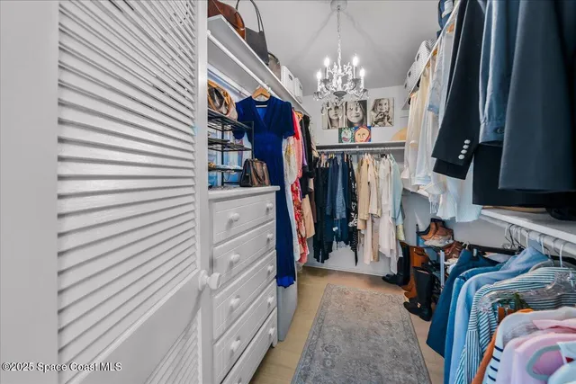 a view of a dining room with furniture large windows and wooden floor