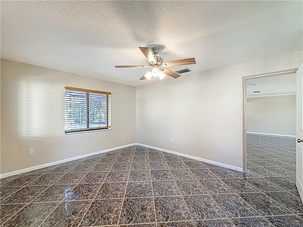4667 Baldric Street Boca Raton, FL 33428 - Photo 13 of 32 a view of an empty room with a window