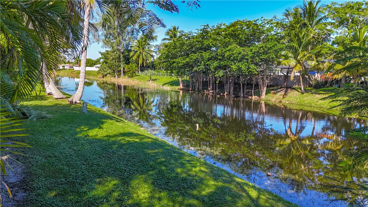 4667 Baldric Street Boca Raton, FL 33428 - Photo 32 of 32 a view of swimming pool from a garden