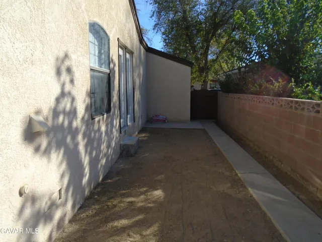 a view of a back yard of the house