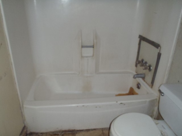 652 Fir Lane Lockhart, TX 78644 - Photo 24 of 26 a bathroom with a sink and bathtub