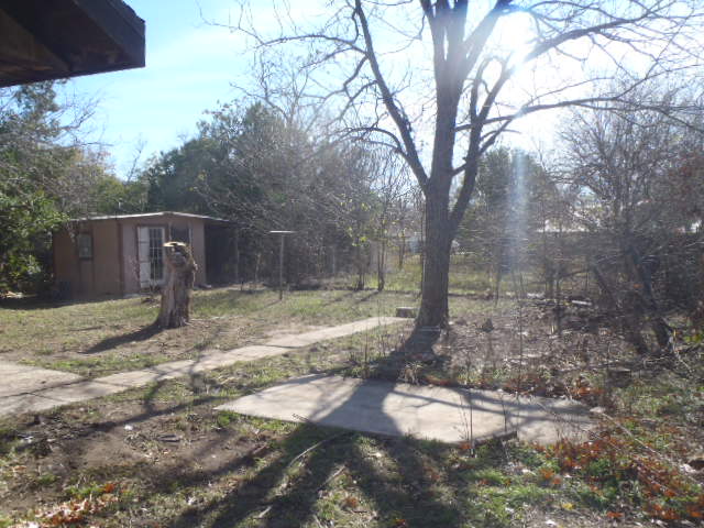 652 Fir Lane Lockhart, TX 78644 - Photo 3 of 26 a backyard of a house with lots of green space