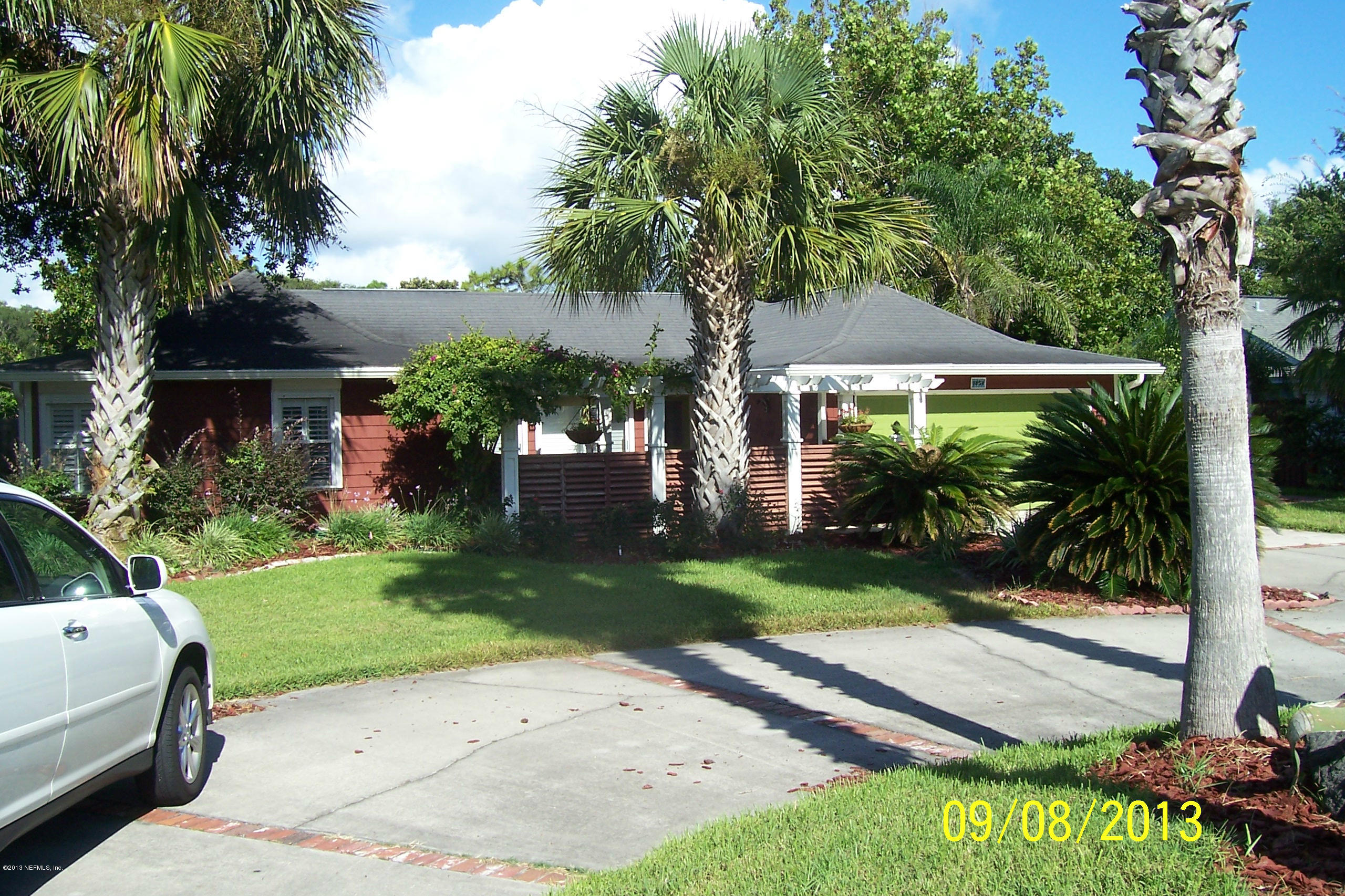 1854 Seminole Road Atlantic Beach, FL 32233 - Photo 3 of 33 a view of a backyard with a garden and plants