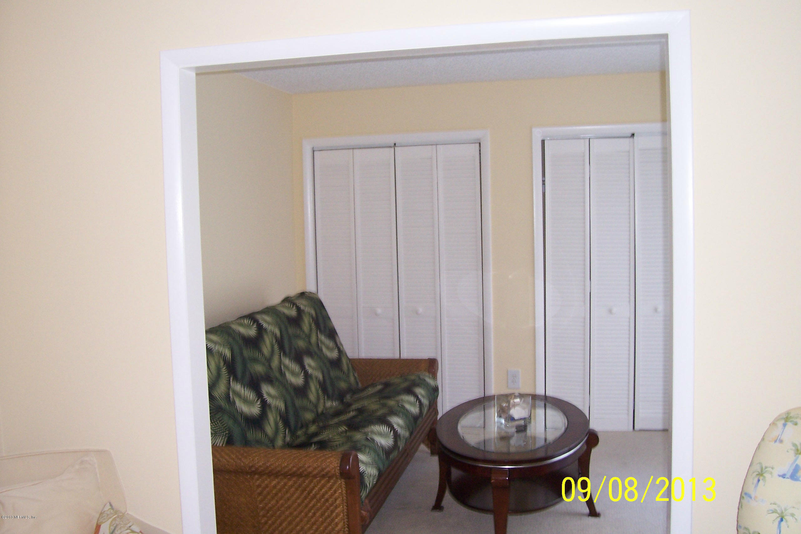 1854 Seminole Road Atlantic Beach, FL 32233 - Photo 31 of 33 a living room with furniture and a window