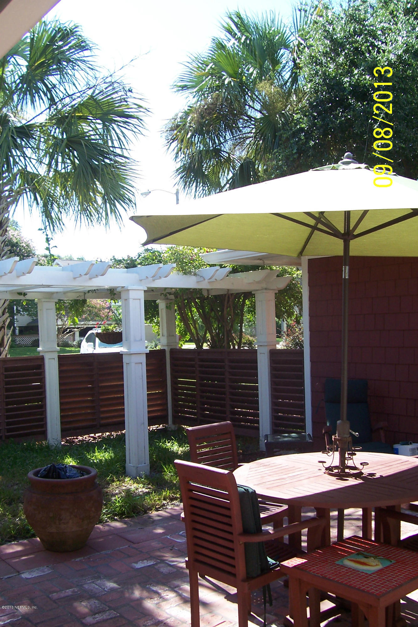 1854 Seminole Road Atlantic Beach, FL 32233 - Photo 8 of 33 a view of a table and chairs in patio of the house