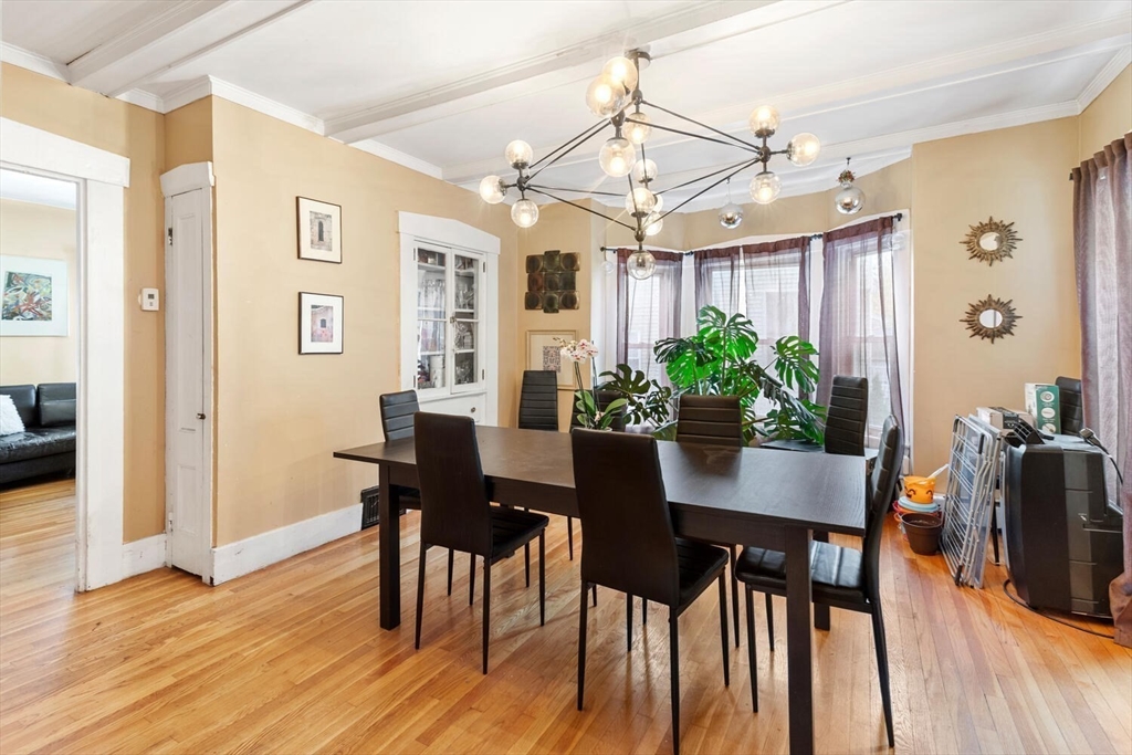 46 Bartlett Street Malden, MA 02148 - Photo 11 of 32 a view of a dining room with furniture and wooden floor