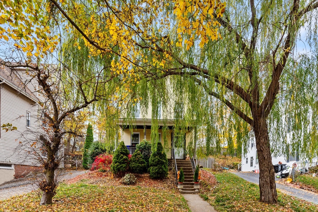 46 Bartlett Street Malden, MA 02148 - Photo 2 of 32 a front view of a house with a yard