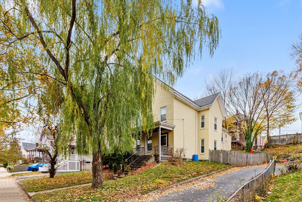 46 Bartlett Street Malden, MA 02148 - Photo 3 of 32 a front view of a house with a yard