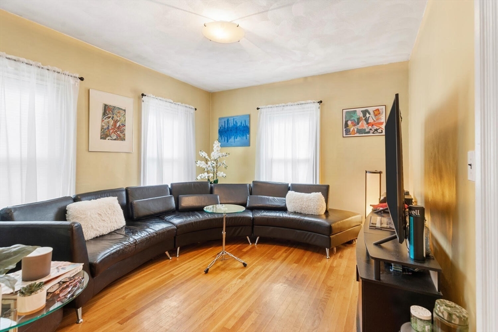 46 Bartlett Street Malden, MA 02148 - Photo 6 of 32 a living room with furniture and a flat screen tv