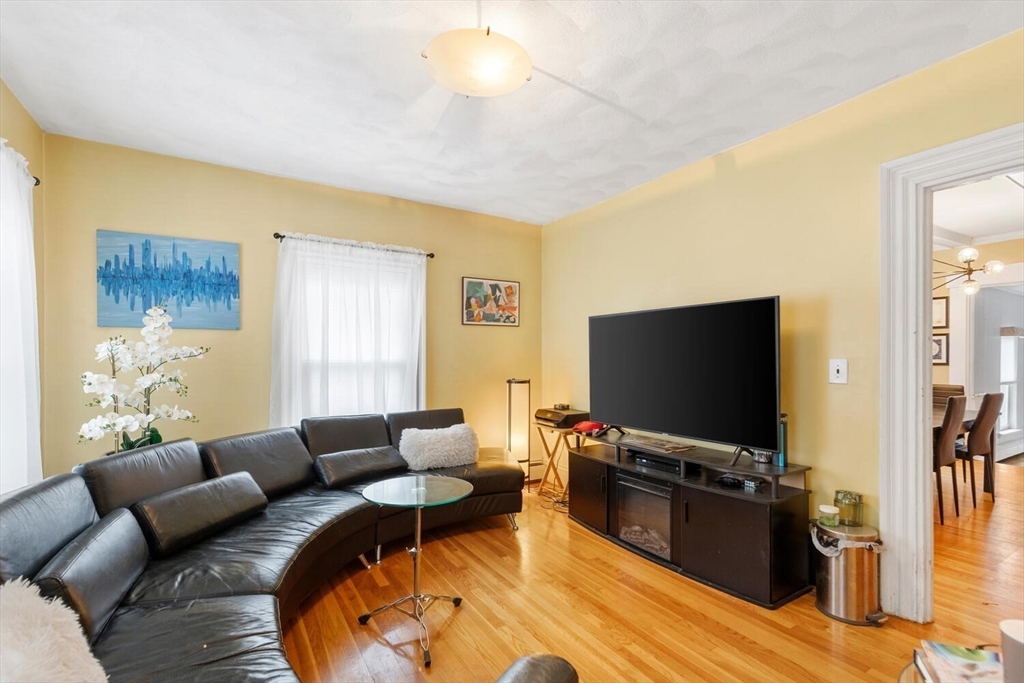 46 Bartlett Street Malden, MA 02148 - Photo 7 of 32 a living room with furniture and a flat screen tv