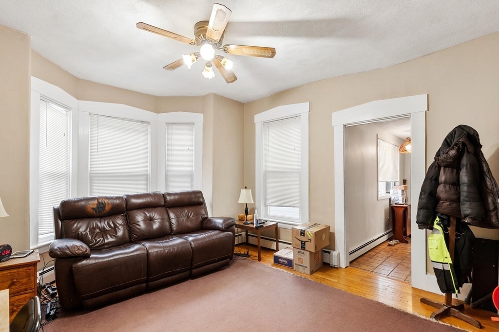 46 Bartlett Street Malden, MA 02148 - Photo 8 of 32 a living room with furniture and wooden floor