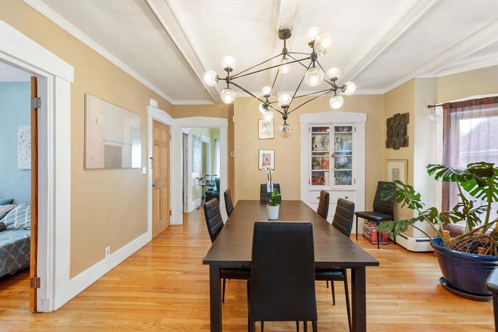 46 Bartlett Street Malden, MA 02148 - Photo 10 of 32 a view of a dining room with furniture and wooden floor