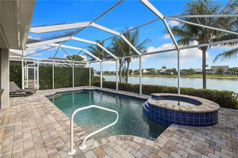 a view of a swimming pool with a patio