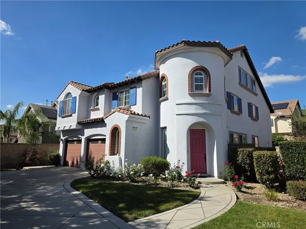a front view of a house with yard
