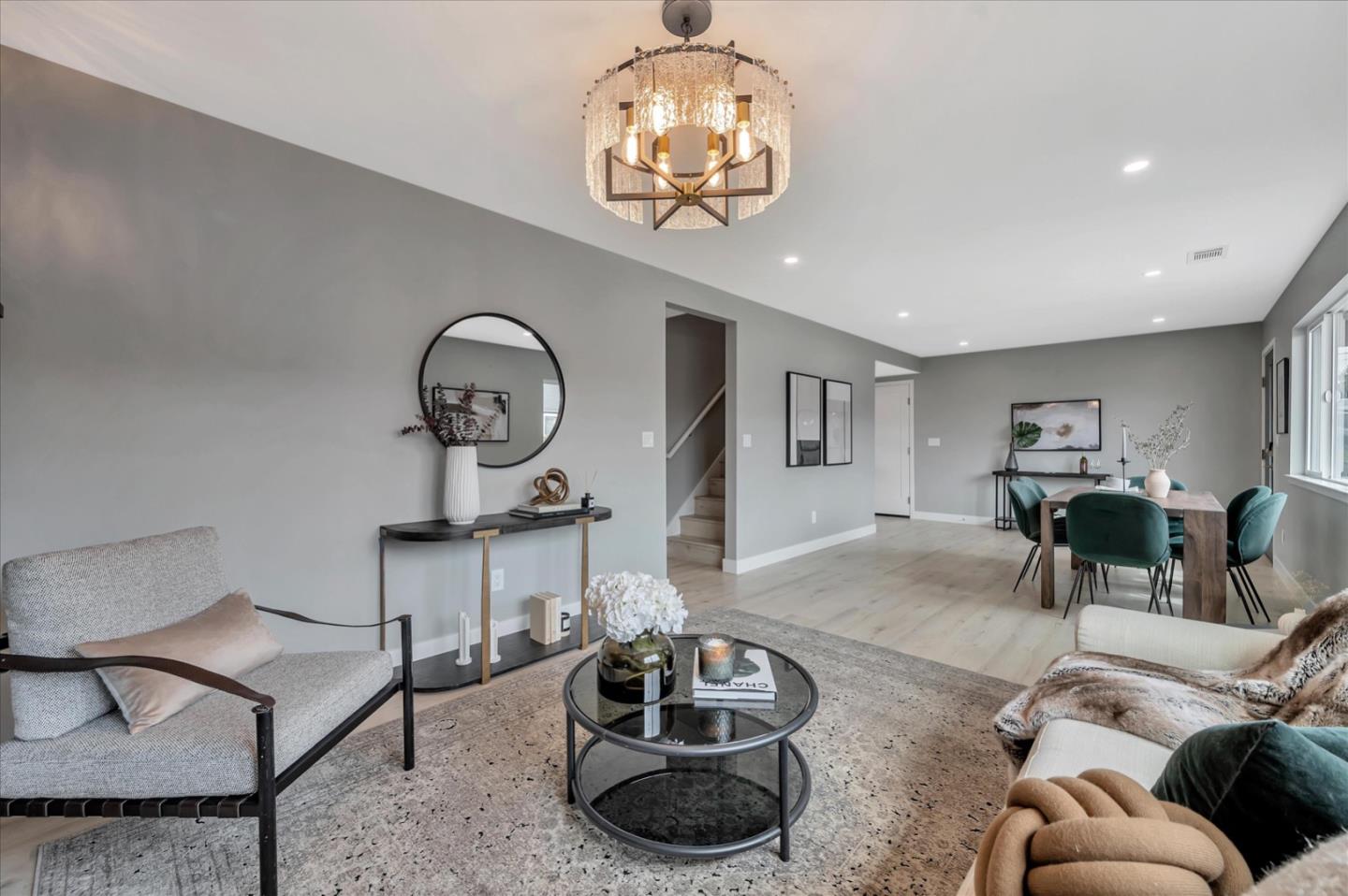 467 Glasgow Drive Pacifica, CA 94044 - Photo 11 of 47 a living room with furniture and a chandelier