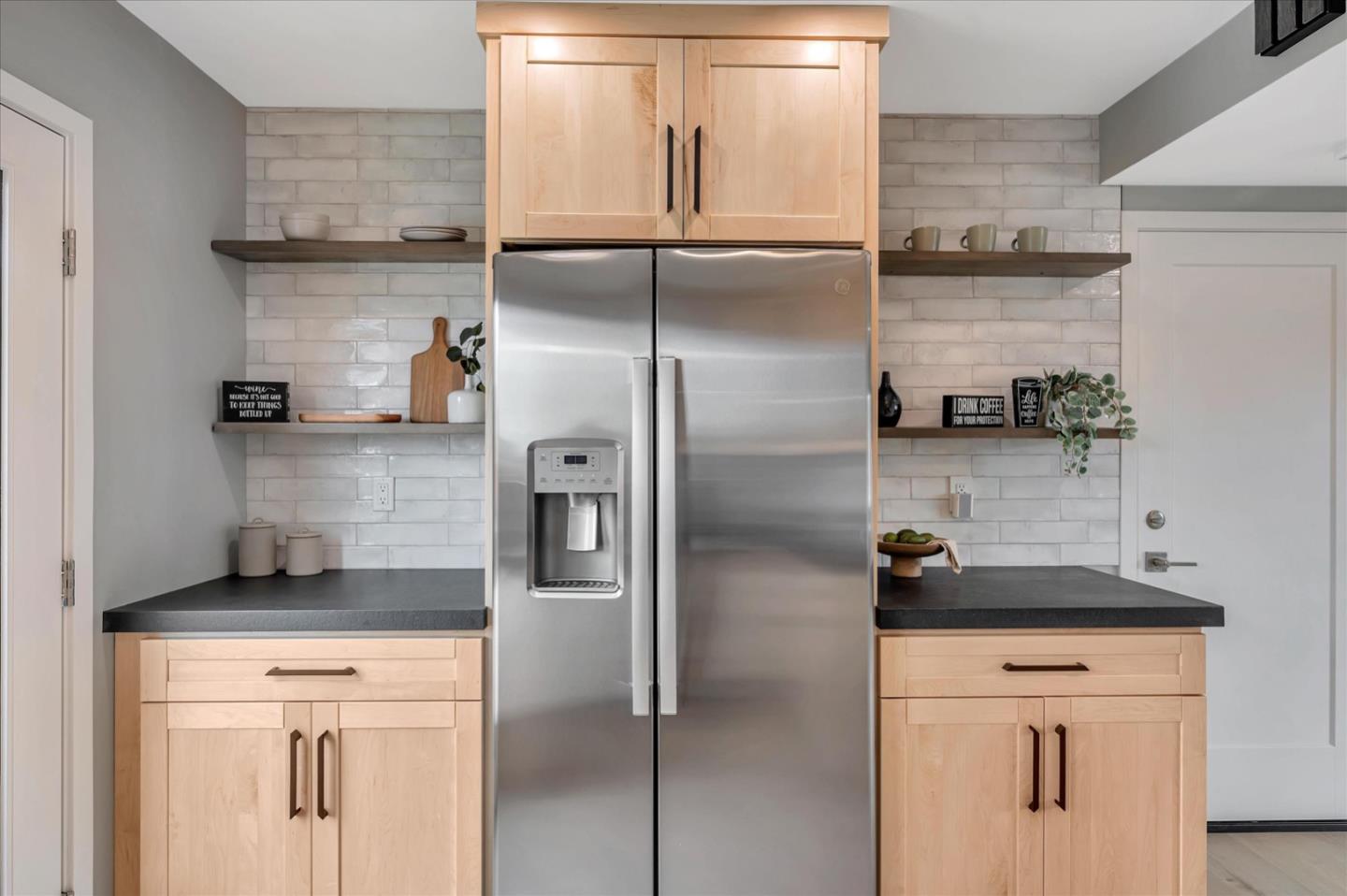 467 Glasgow Drive Pacifica, CA 94044 - Photo 12 of 47 a kitchen with a refrigerator and a stove