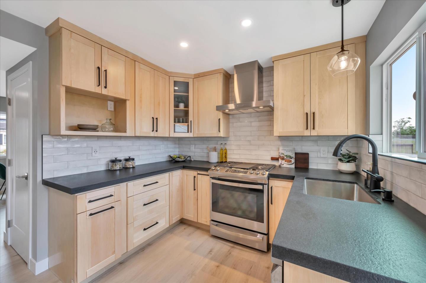 467 Glasgow Drive Pacifica, CA 94044 - Photo 16 of 47 a kitchen with a sink stove and microwave