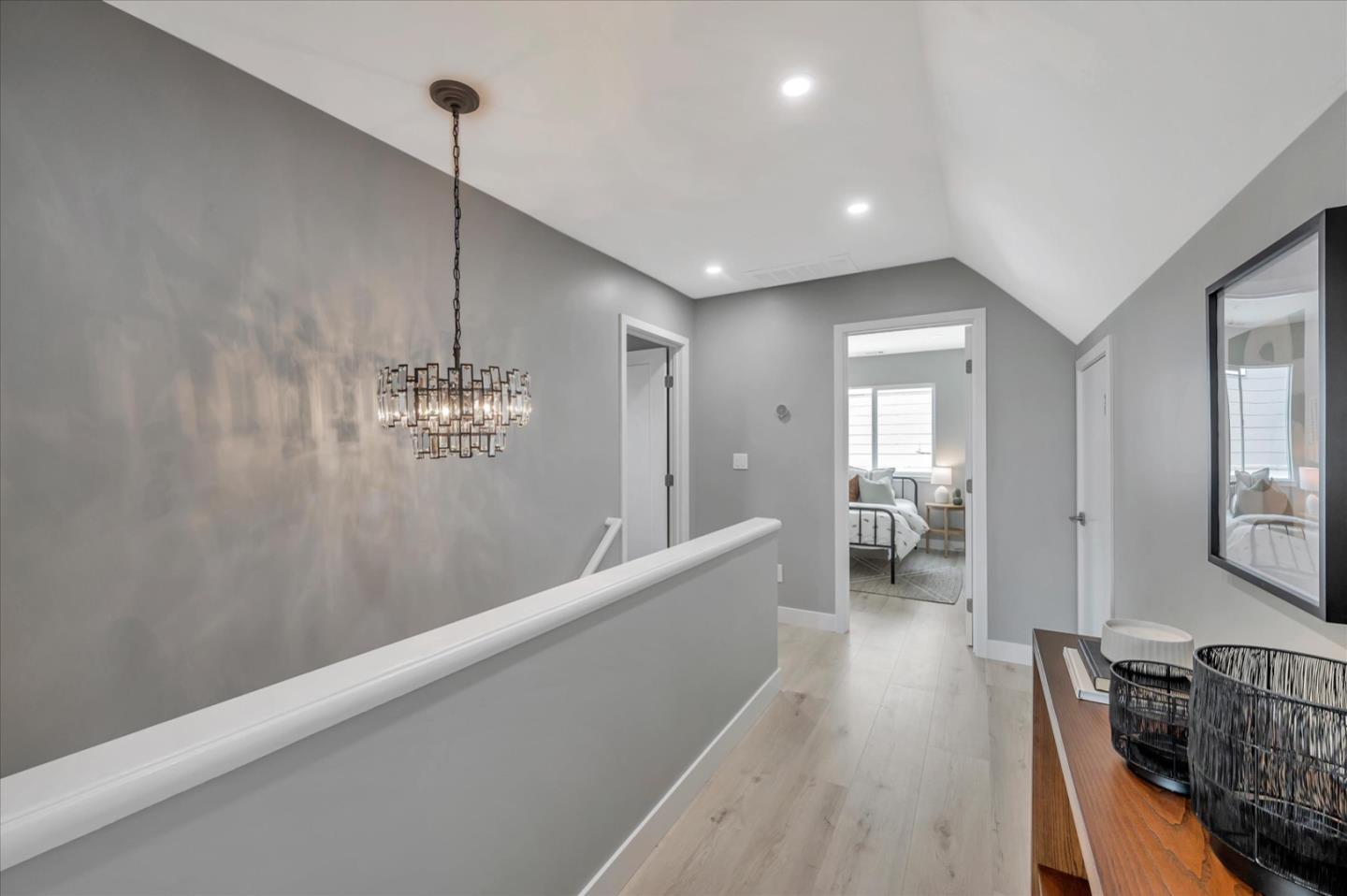 467 Glasgow Drive Pacifica, CA 94044 - Photo 20 of 47 a view of a hallway with wooden floor and staircase