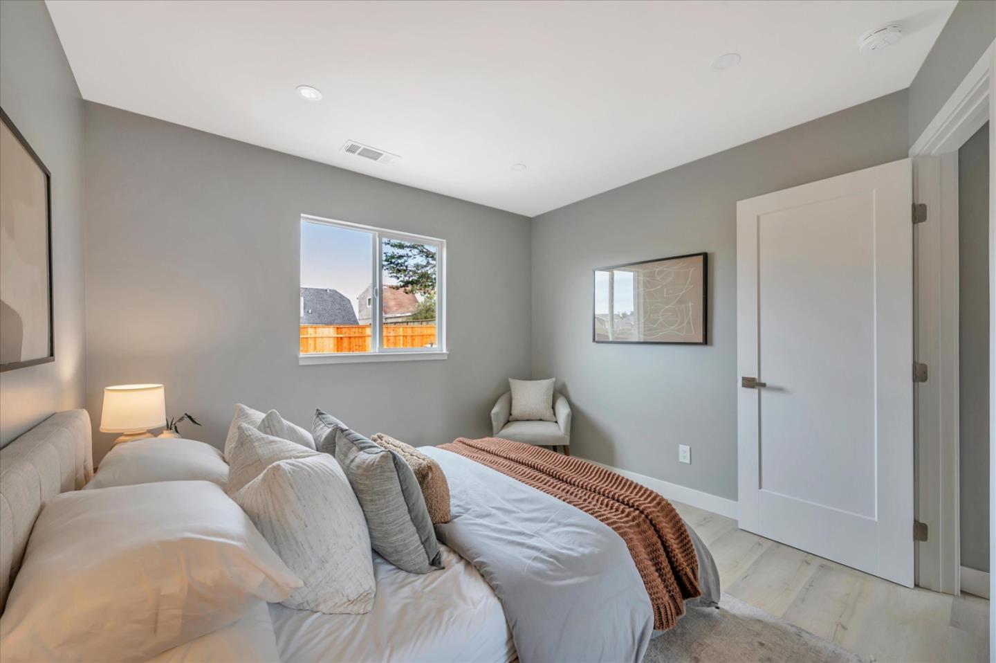 467 Glasgow Drive Pacifica, CA 94044 - Photo 23 of 47 a bedroom with a bed and a lamp on dresser