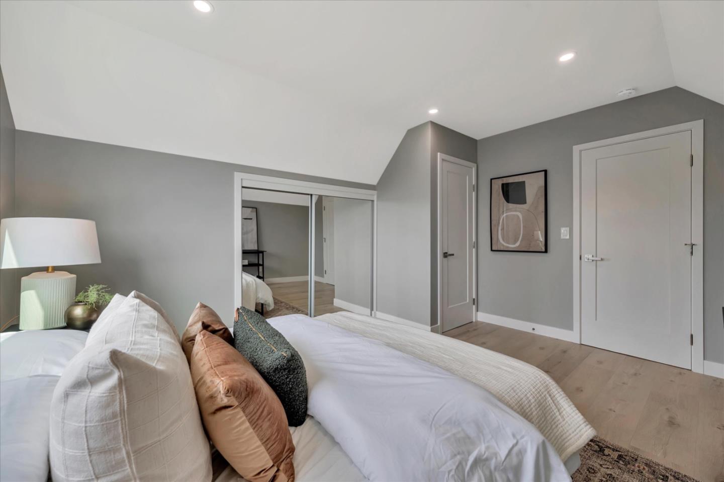 467 Glasgow Drive Pacifica, CA 94044 - Photo 31 of 47 a bedroom with a bed and a lamp