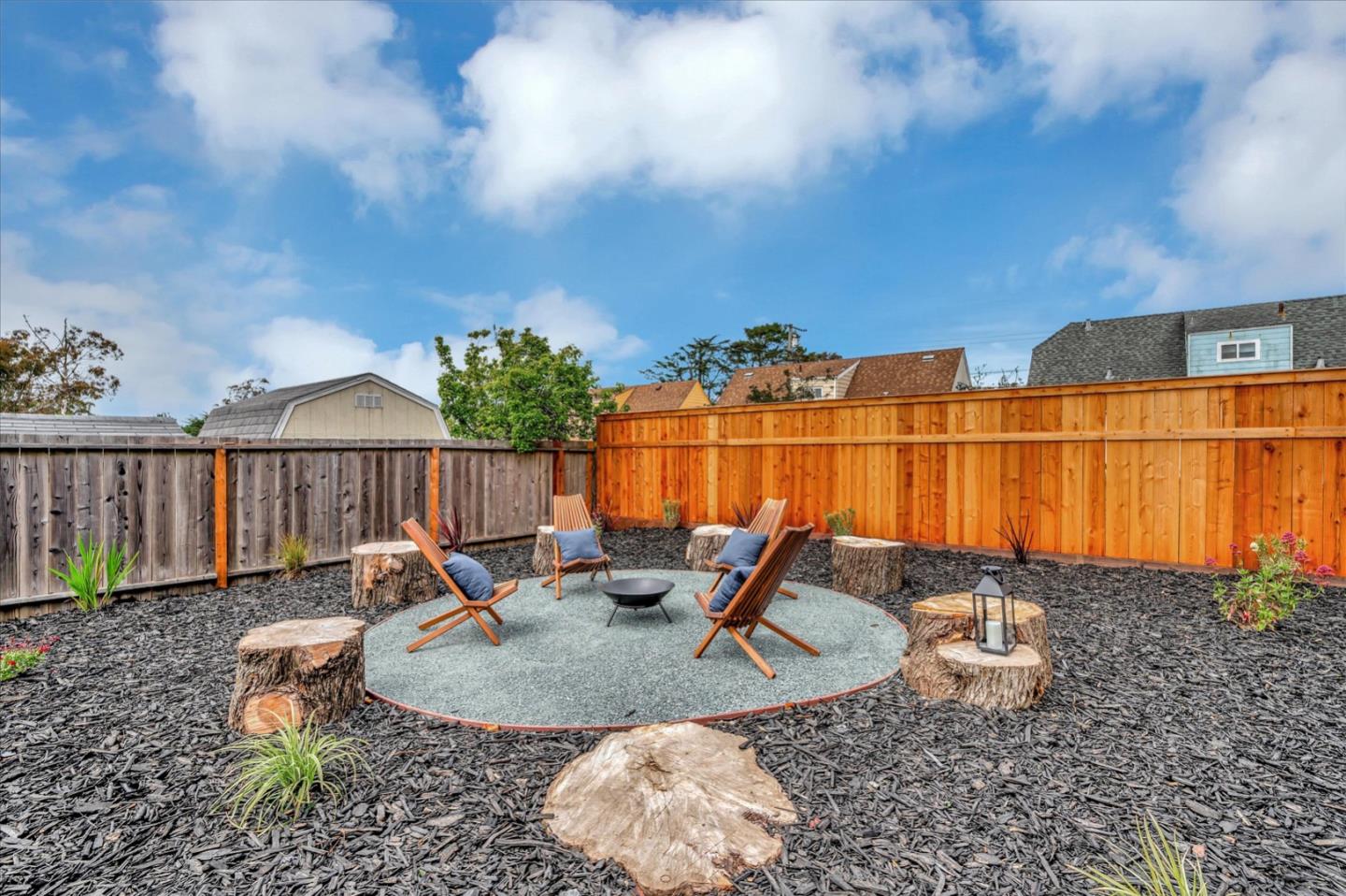 467 Glasgow Drive Pacifica, CA 94044 - Photo 43 of 47 a backyard of a house with table and chairs