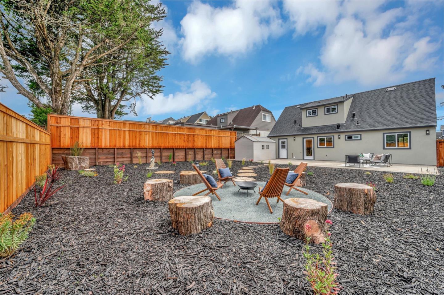 467 Glasgow Drive Pacifica, CA 94044 - Photo 45 of 47 a view of a patio with couches and table and chairs and potted plants