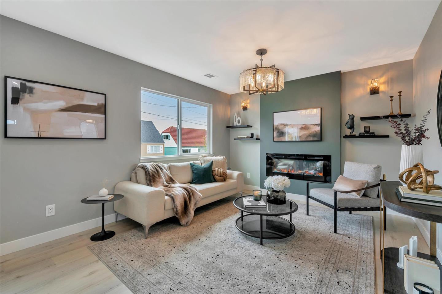 467 Glasgow Drive Pacifica, CA 94044 - Photo 7 of 47 a living room with furniture a chandelier and a flat screen tv