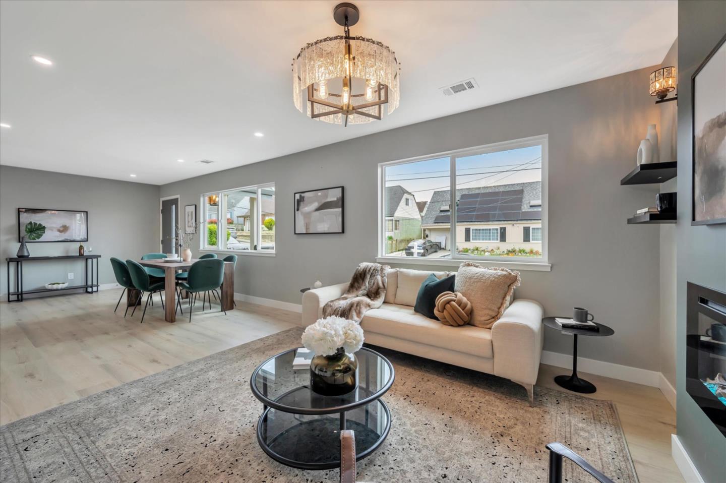 467 Glasgow Drive Pacifica, CA 94044 - Photo 10 of 47 a living room with furniture chandelier and a large window
