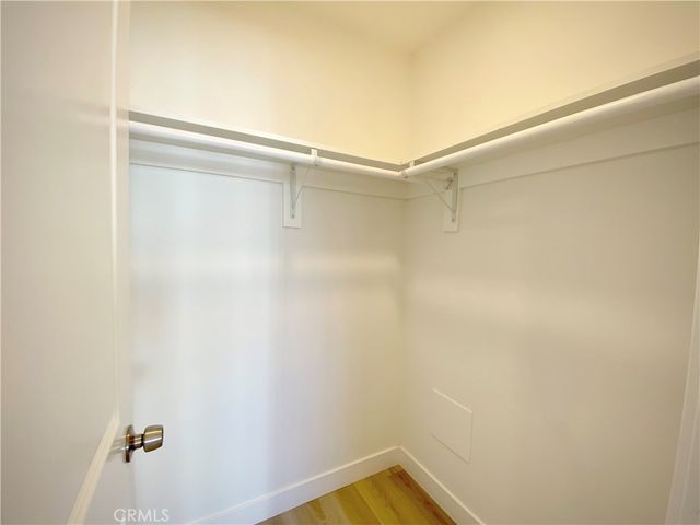 a view of a room with shelf on the wall