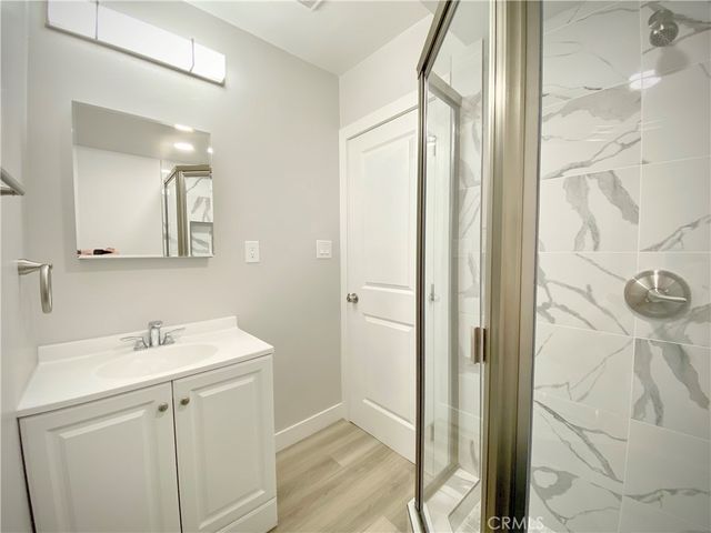a bathroom with a sink and mirror