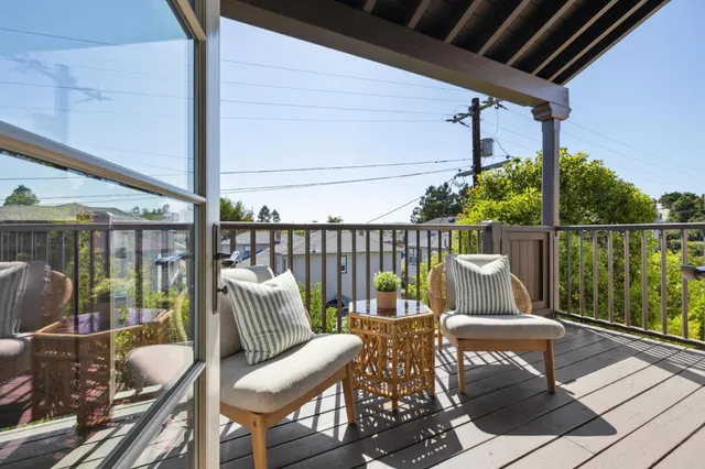 a large kitchen with stainless steel appliances granite countertop a lot of counter space and wooden floors